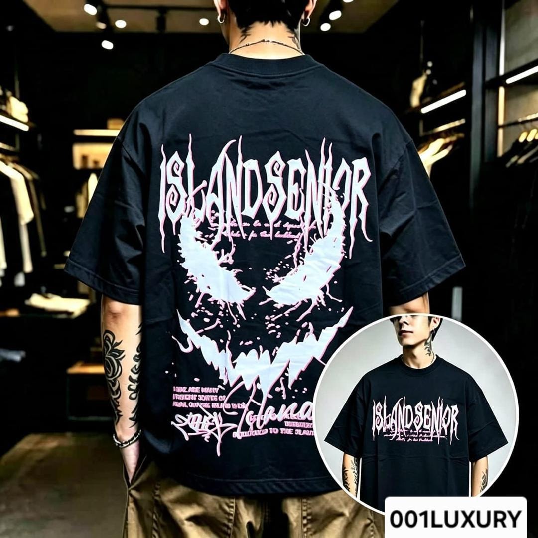 Man in black oversized T-shirt with Island Senior pink graphic and text on back.