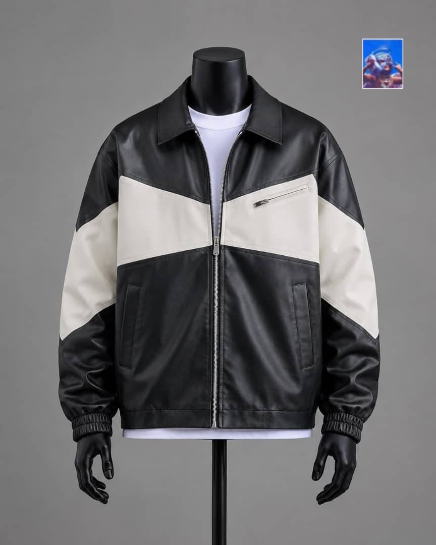Black and cream colorblock faux leather bomber jacket on mannequin.