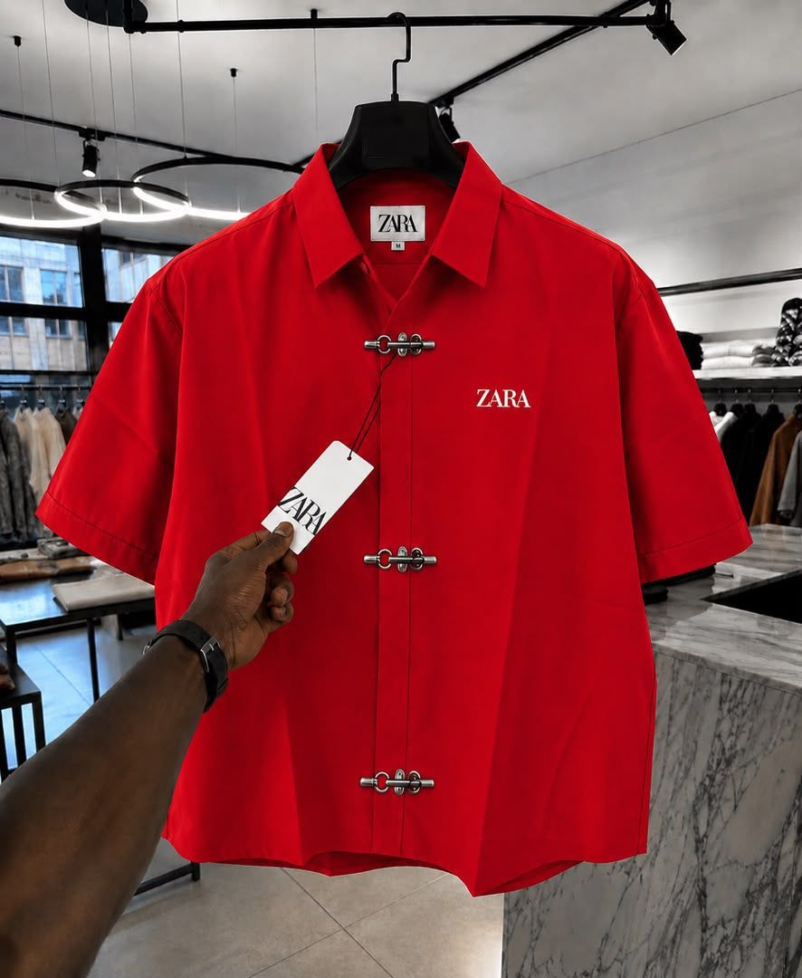 Red ZARA short sleeve shirt with toggle closures and chest logo.