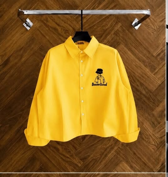 Yellow long sleeve button-down shirt with Boom Good cartoon graphic on chest.