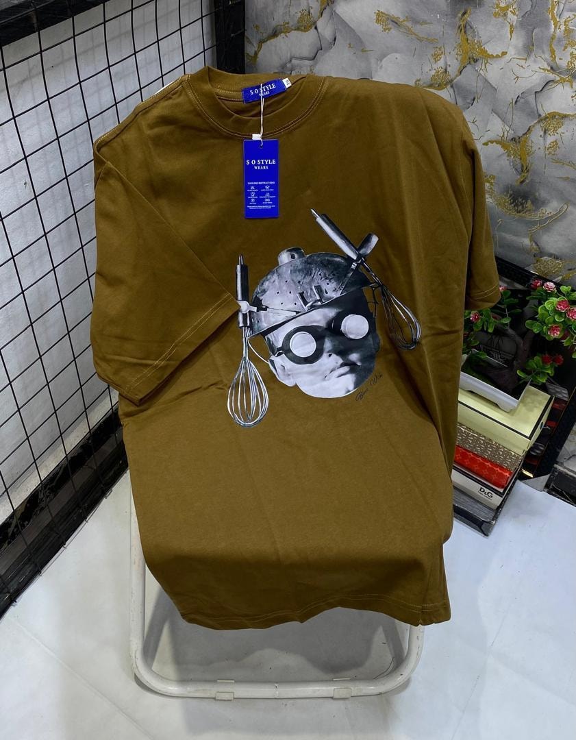 Light blue t-shirt with devil face, horns, halo and tongue graphic print.