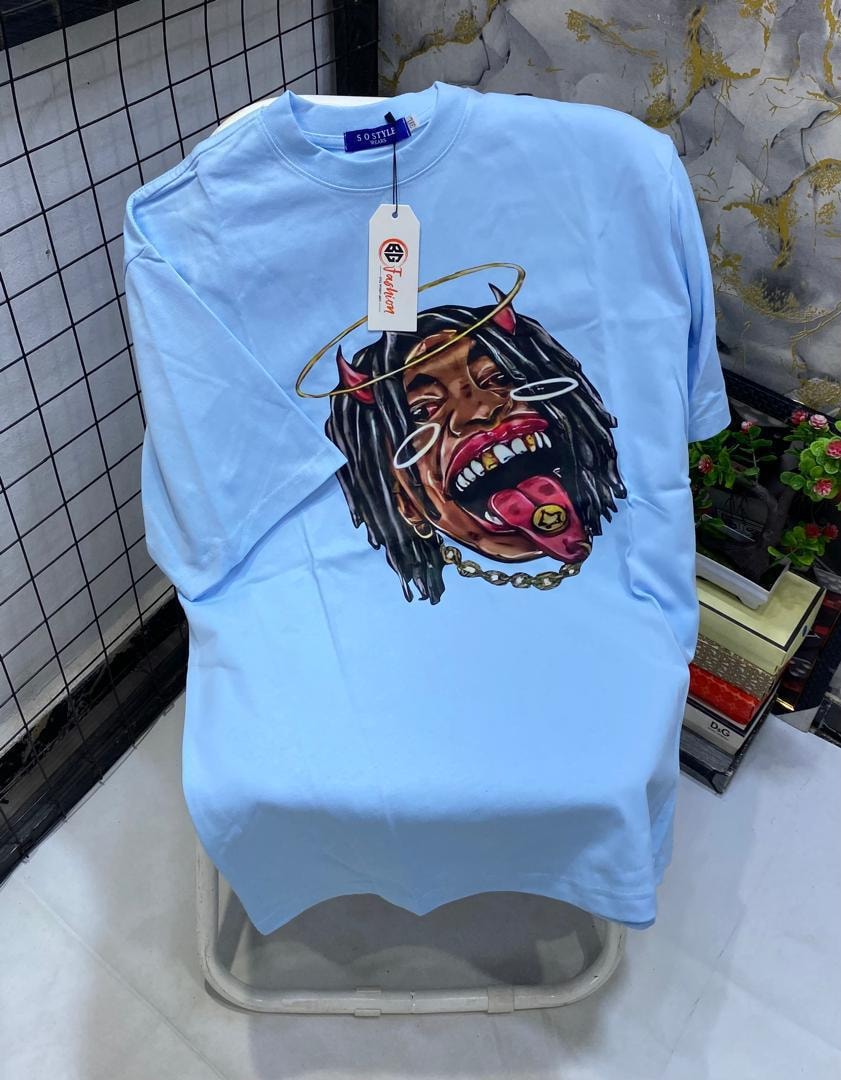 Brown t-shirt with surreal face and kitchen utensils graphic print.