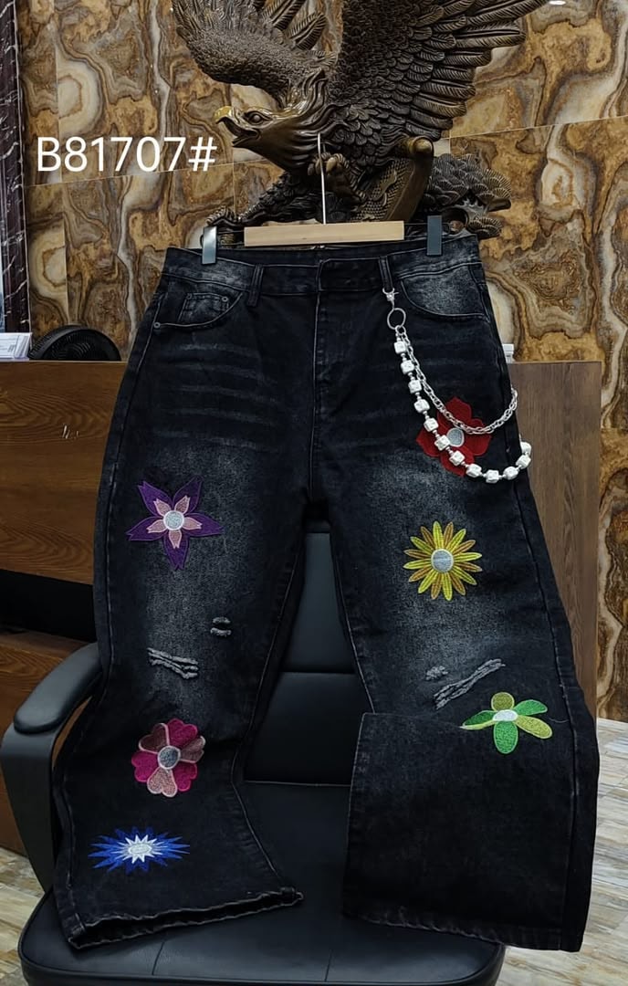 Black baggy jeans with colorful flower embroidery patches and silver beaded chain.