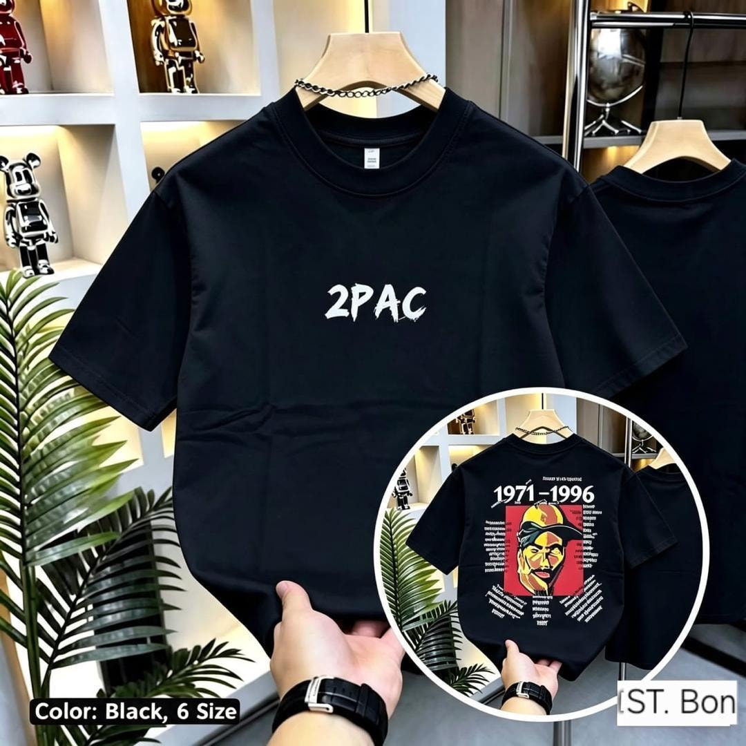 Black 2Pac t-shirt on hanger with front text and circular inset showing back tribute graphic.