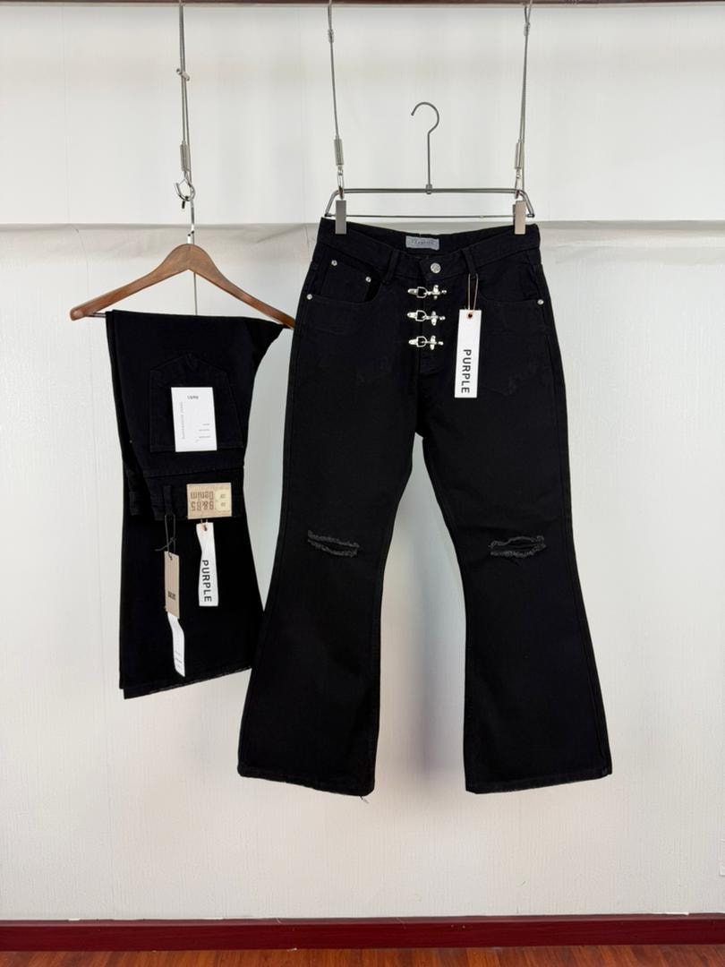 Black flare jeans with silver chain, cross pendant, lace-up waist and small white leg graphic, shown with miniature pair.