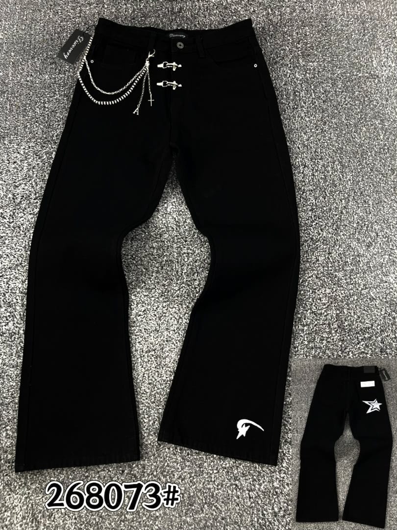 Black lace-up ripped flare jeans hanging next to folded pair with PURPLE tags and G882 label.