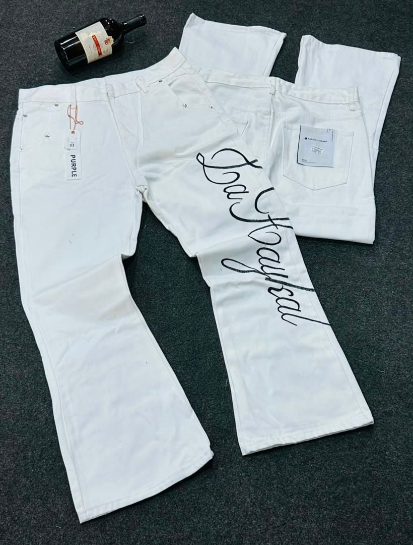 Gray washed ripped flare jeans hanging with PURPLE tags and G2111 label.