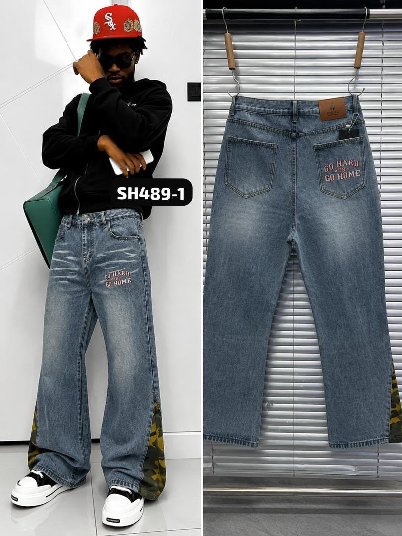 Light blue jeans with GO HARD OR GO HOME text and camo accents, shown on model and flat lay.