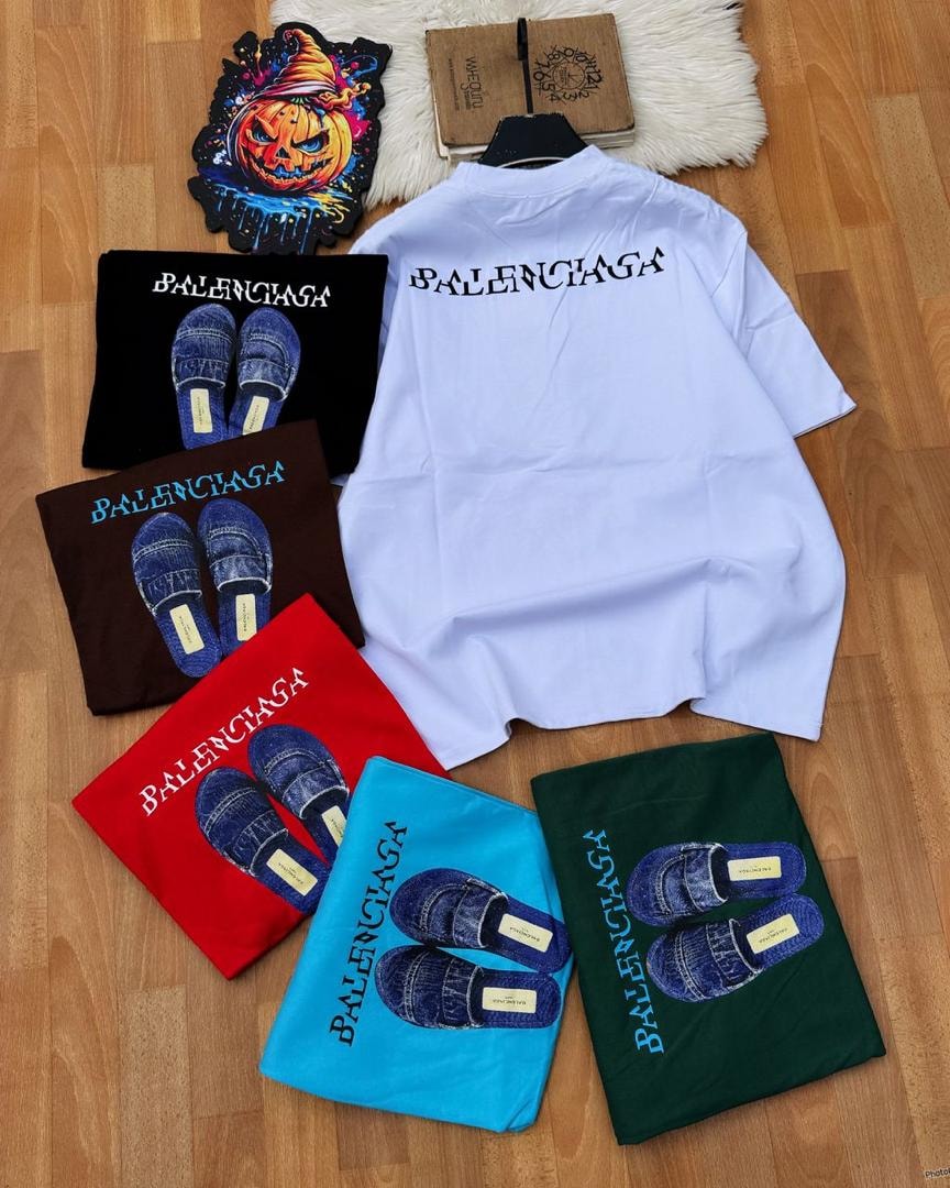 Group of Balenciaga graphic t-shirts in multiple colors including white, black, red, green, blue and brown.