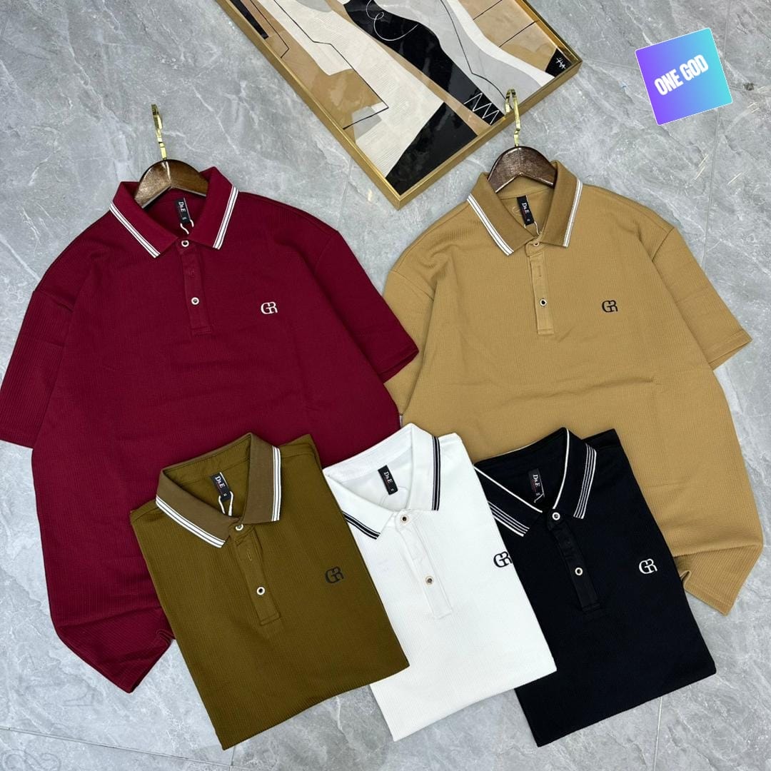 Group of five luxury polo shirts in maroon, tan, olive, white and black with embroidered logos and striped collars.