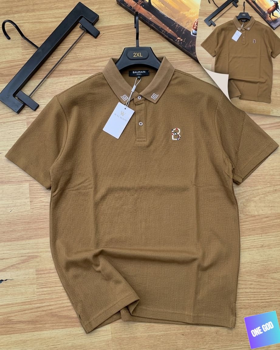 Brown Balmain luxury polo shirt with snake B logo and geometric collar details.