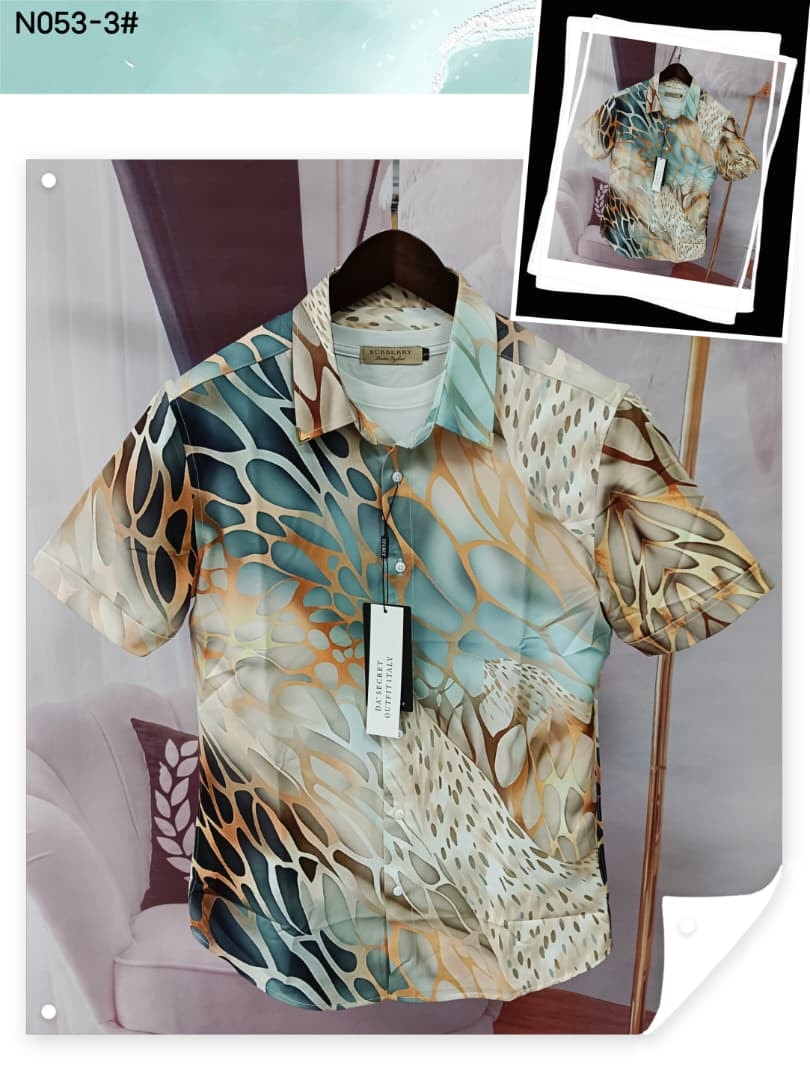 Teal beige and brown abstract pattern short sleeve shirt hanging with inset view.