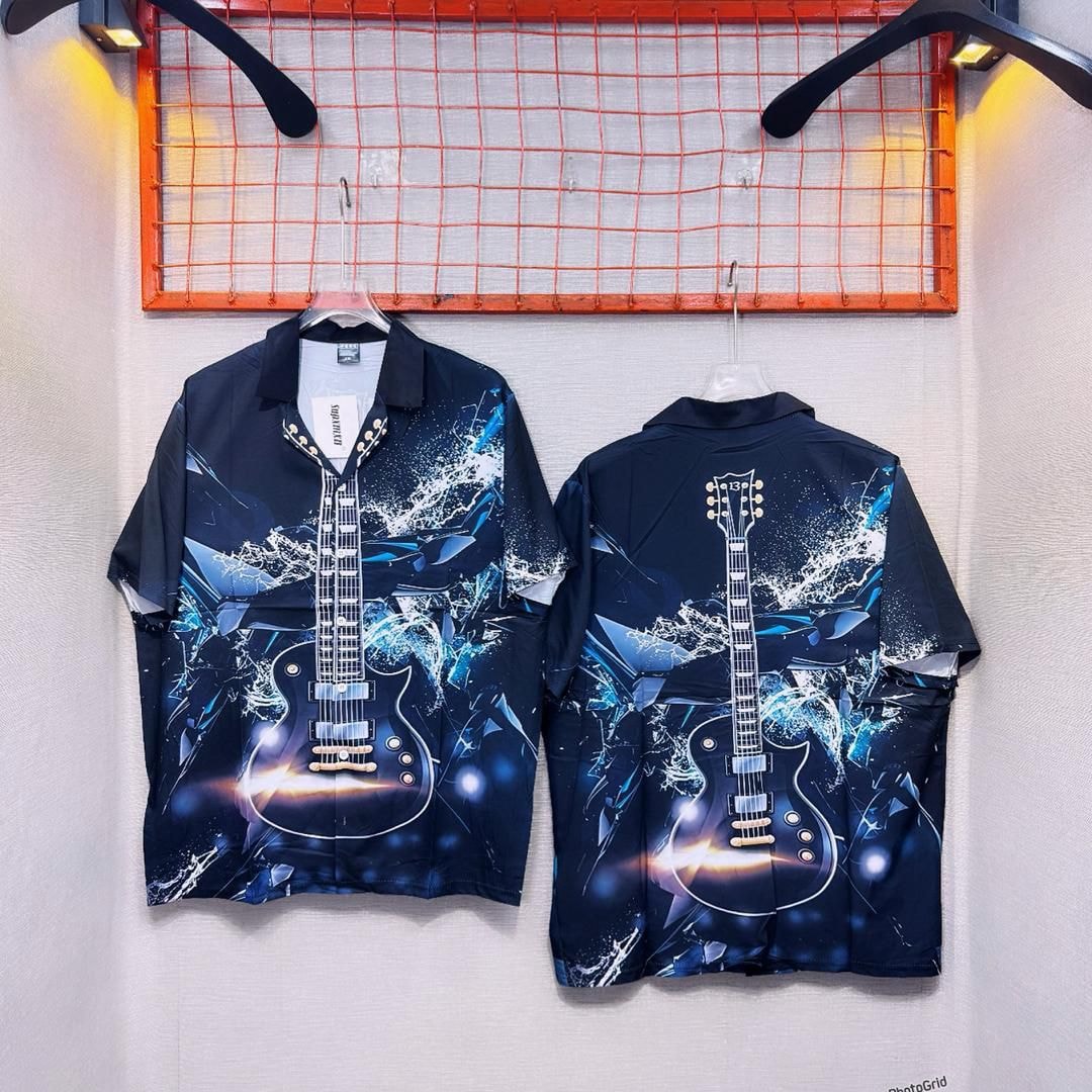 Front and back views of dark blue electric guitar print short sleeve button-up shirt hanging on display.