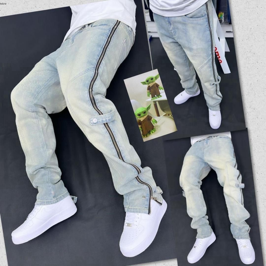 Multiple angles of light blue baggy jeans with zippers, flaps and white sneakers on black background.