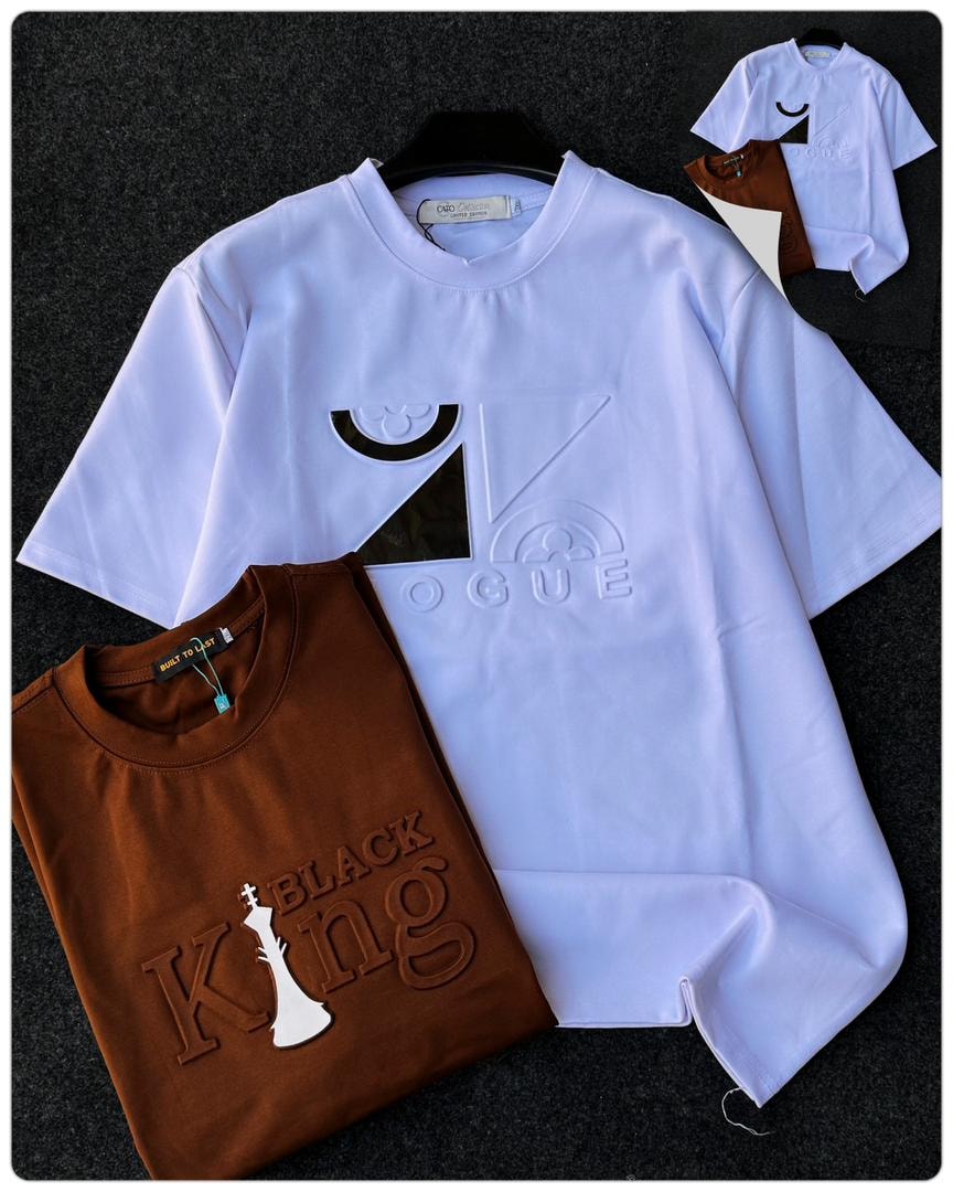 White Vogue graphic round neck t-shirt with embossed geometric patterns and lettering.