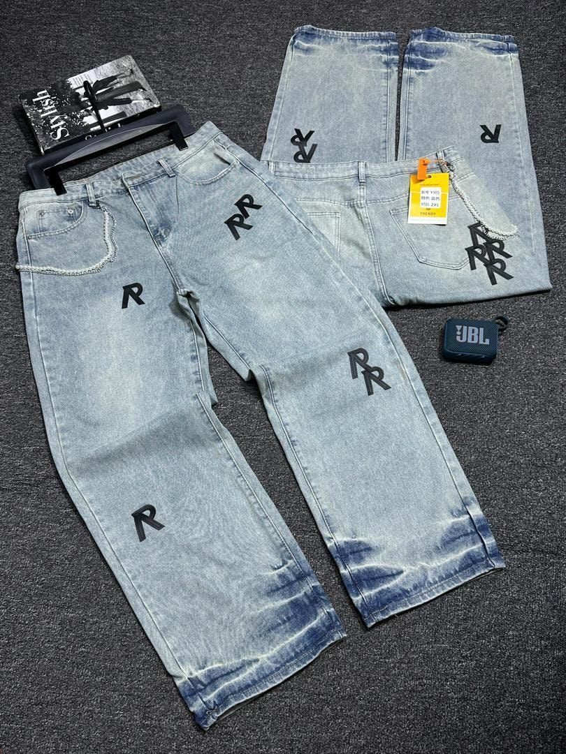 Light blue baggy jeans with all-over repeating RR monogram print, flat lay view.