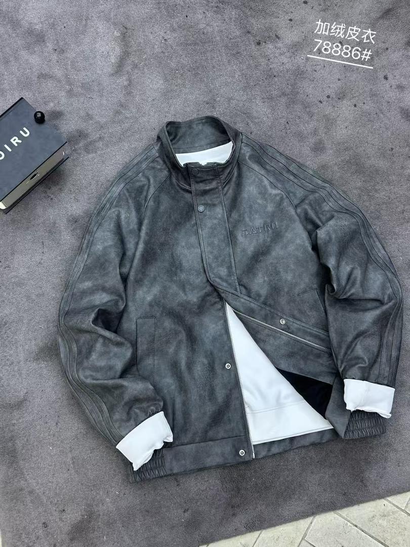 Front view of open dark gray faux leather bomber jacket with white lining.