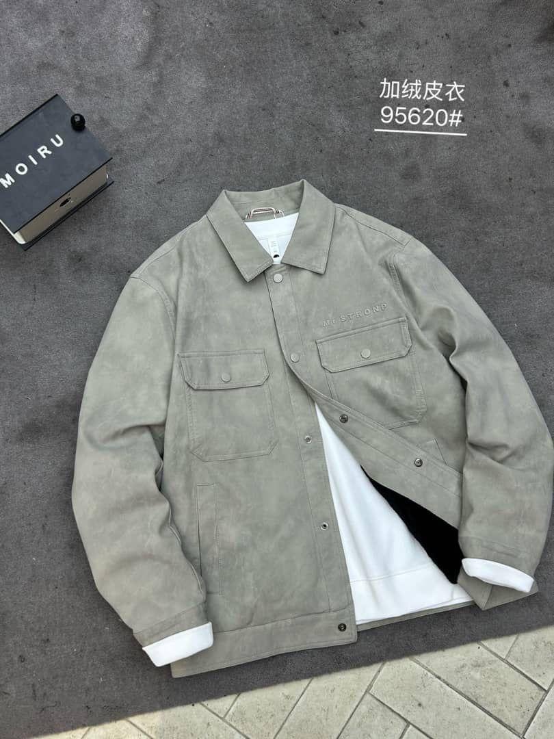Flat lay view of gray faux suede shirt jacket opened over white tee.