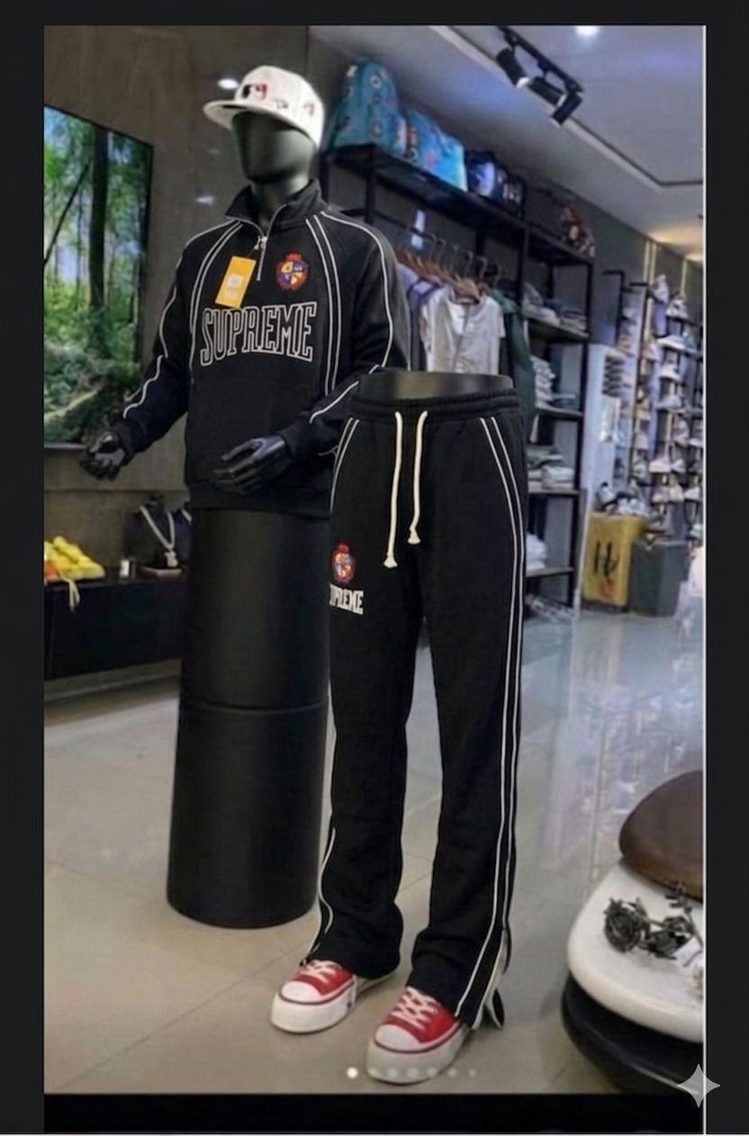 Black Supreme tracksuit set on mannequin with flat lay details.