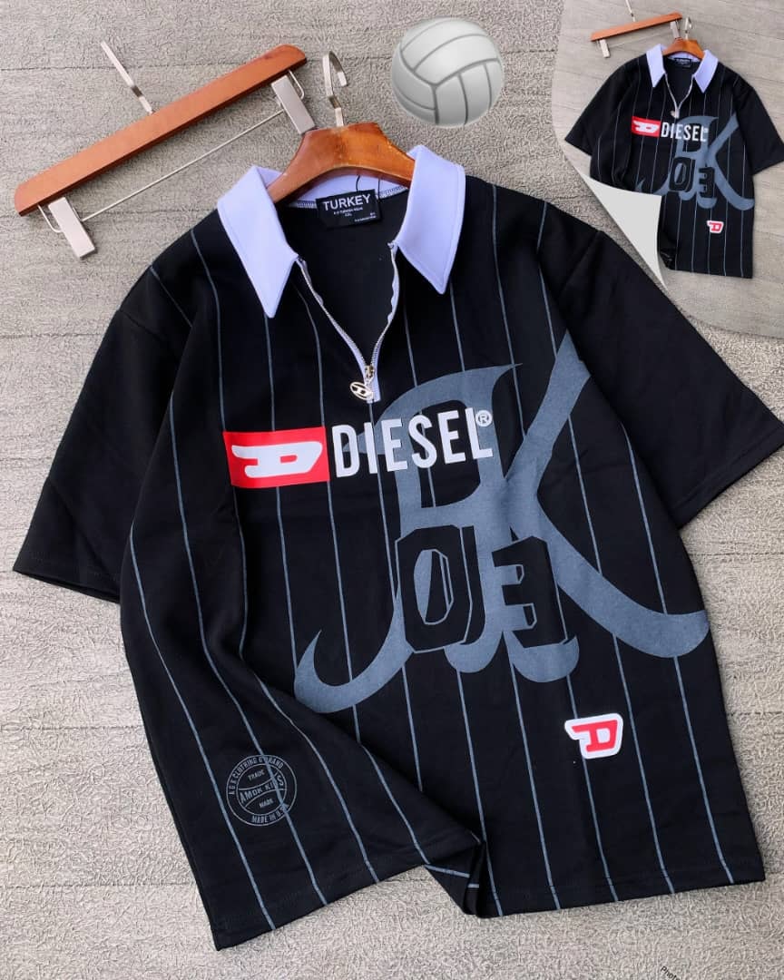 Black striped Diesel graphic polo shirt on hanger with props.