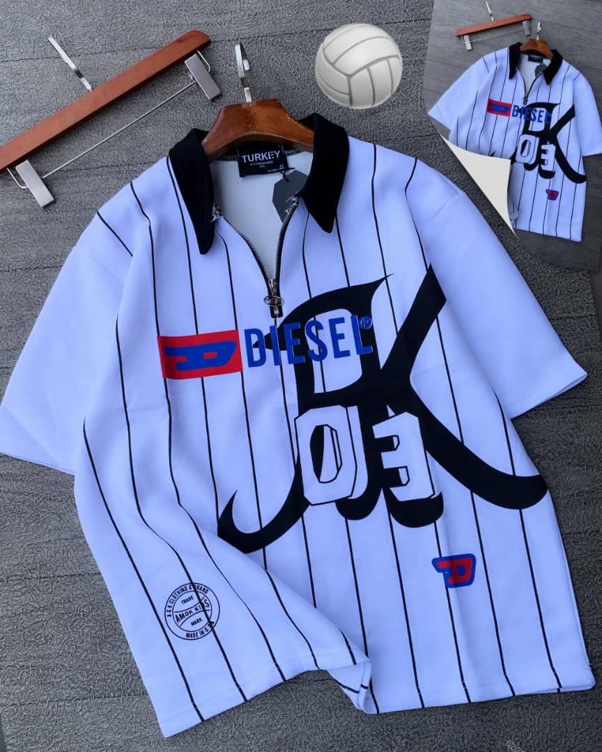 White striped Diesel graphic polo shirt on hanger with props.