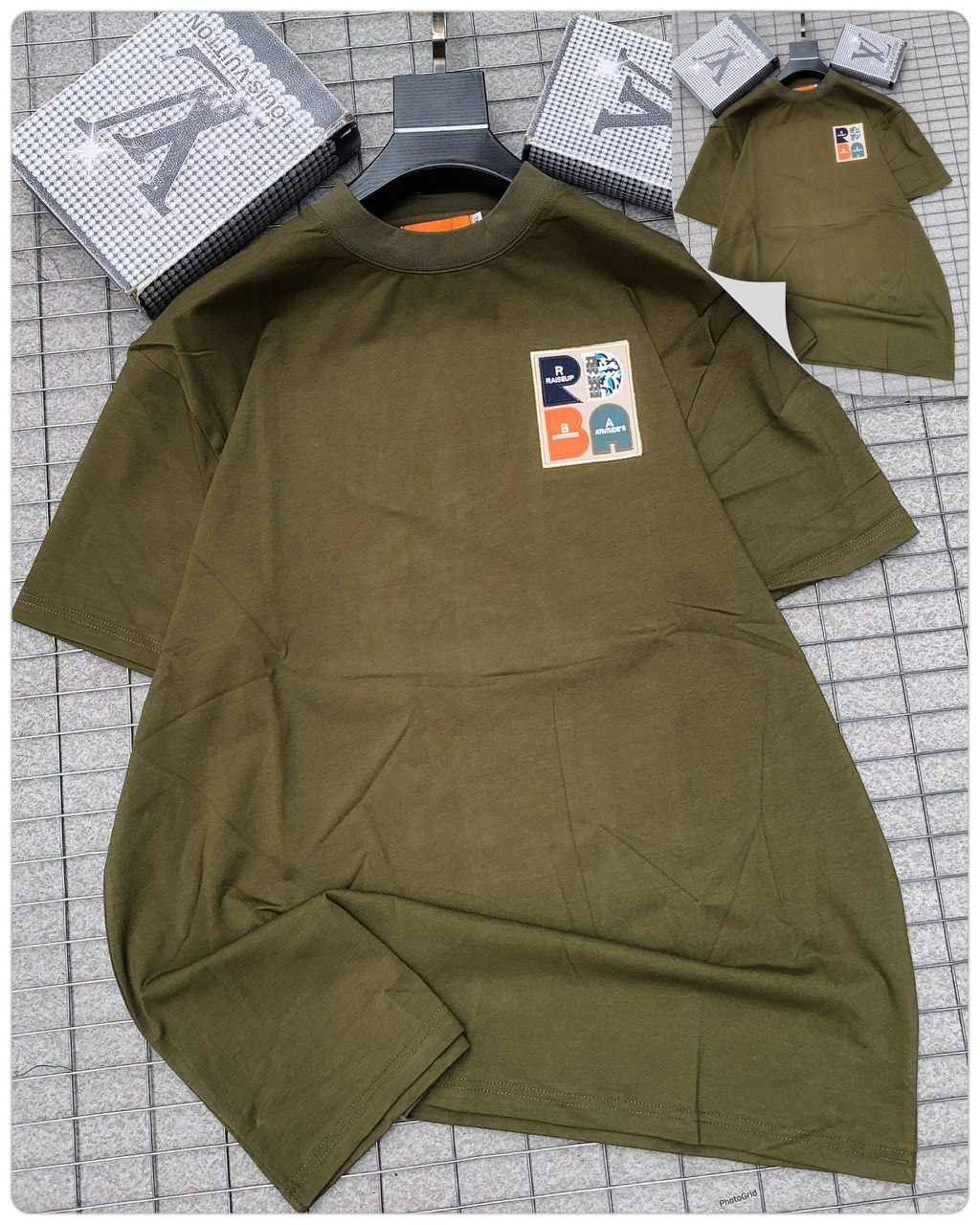 Olive green round neck t-shirt with RBA patch on chest.