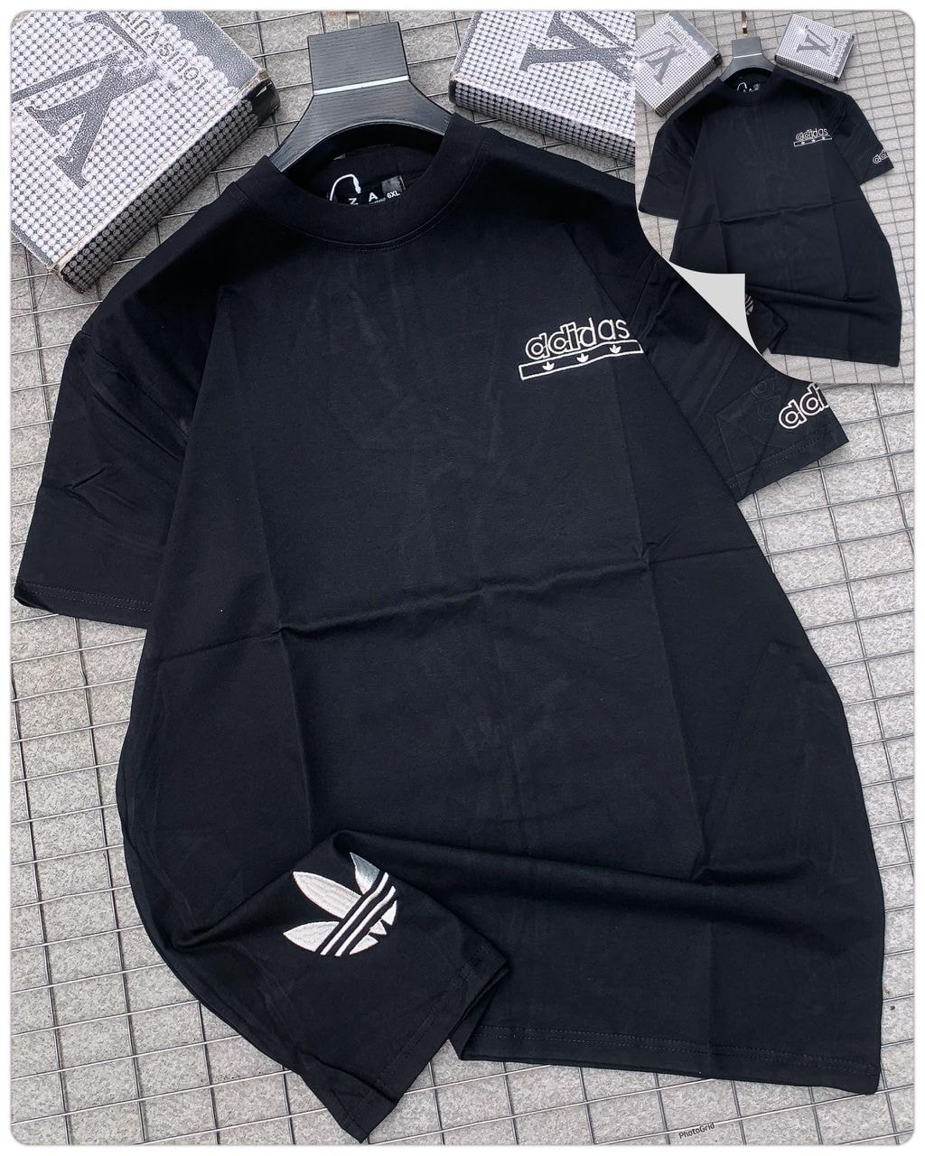 Black Adidas logo round neck t-shirt with sleeve and chest branding.