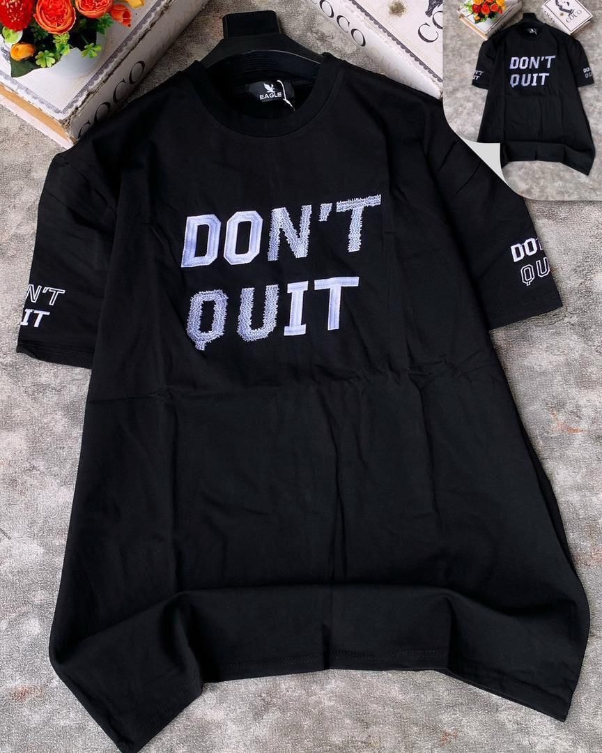 Black Don't Quit embroidered round neck t-shirt with chest and sleeve text.