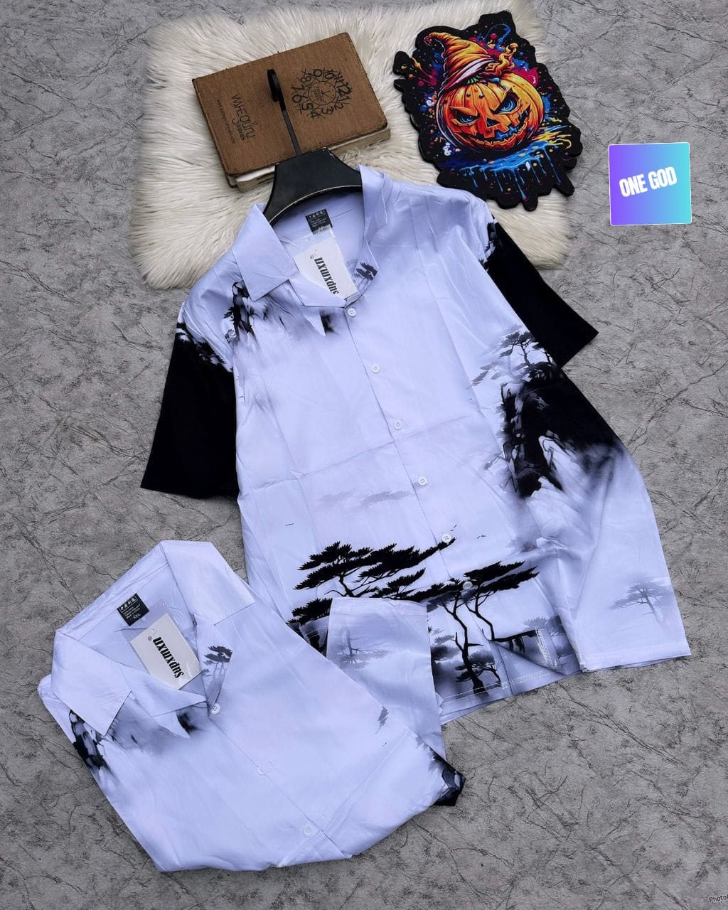 White shirt and shorts with black landscape ink print.