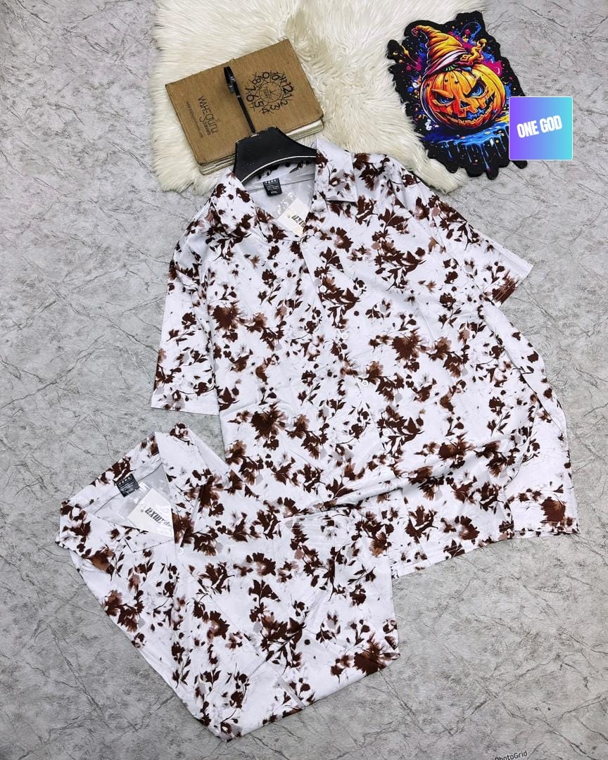 White and brown floral tie-dye pattern short sleeve shirt and matching shorts set.