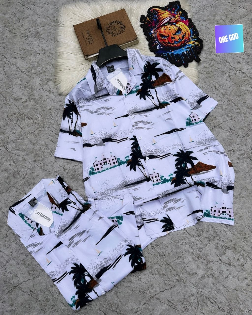 White short sleeve shirt and shorts set with coastal palm tree, house and sailboat print.