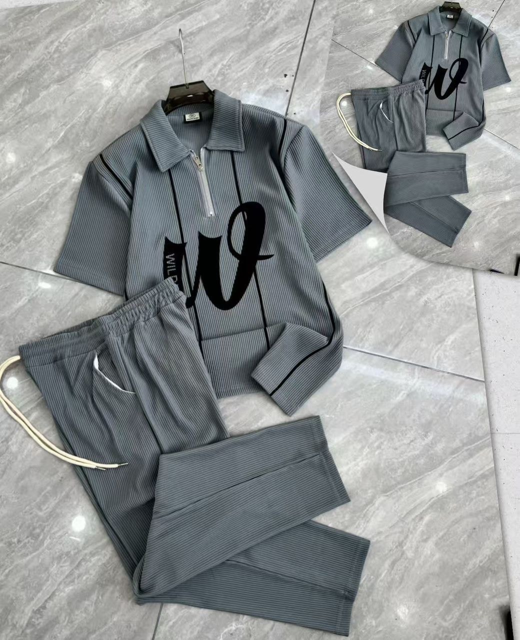 Gray ribbed two-piece set with zip polo shirt and matching pants.