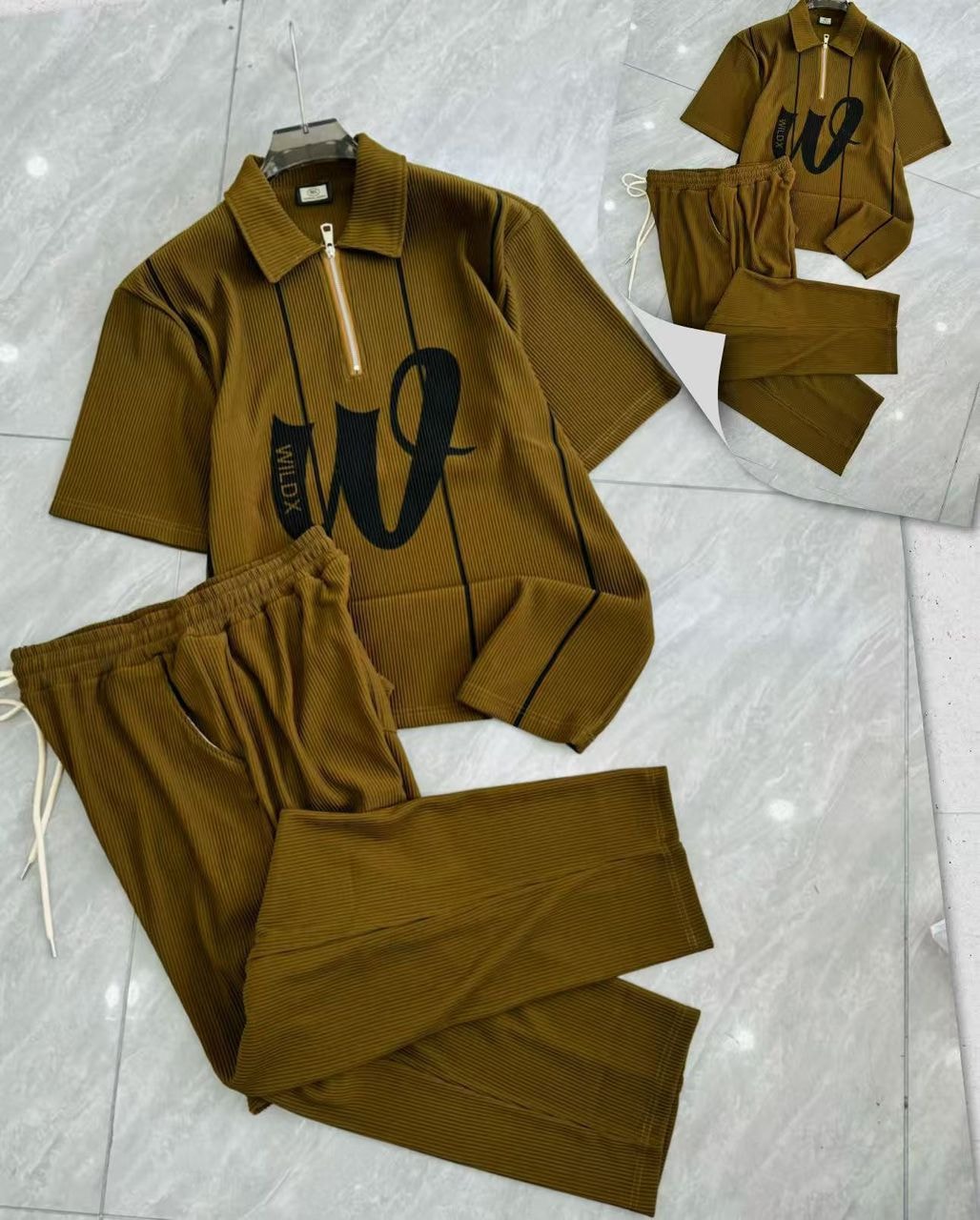 Brown ribbed two-piece set with zip polo shirt and matching pants.