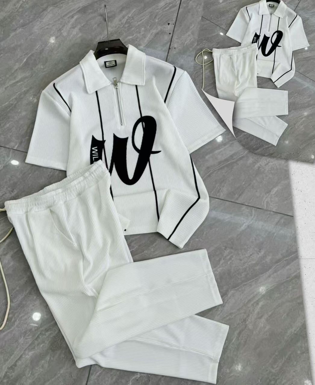 White ribbed two-piece set with zip polo shirt and matching pants.
