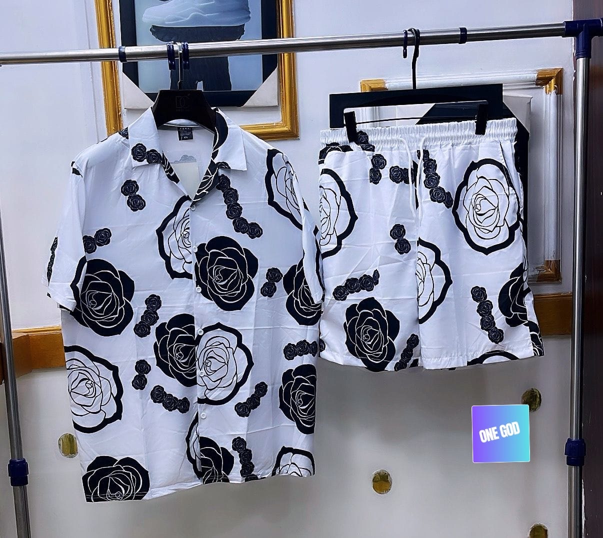 White two-piece shirt and shorts set with black rose prints.
