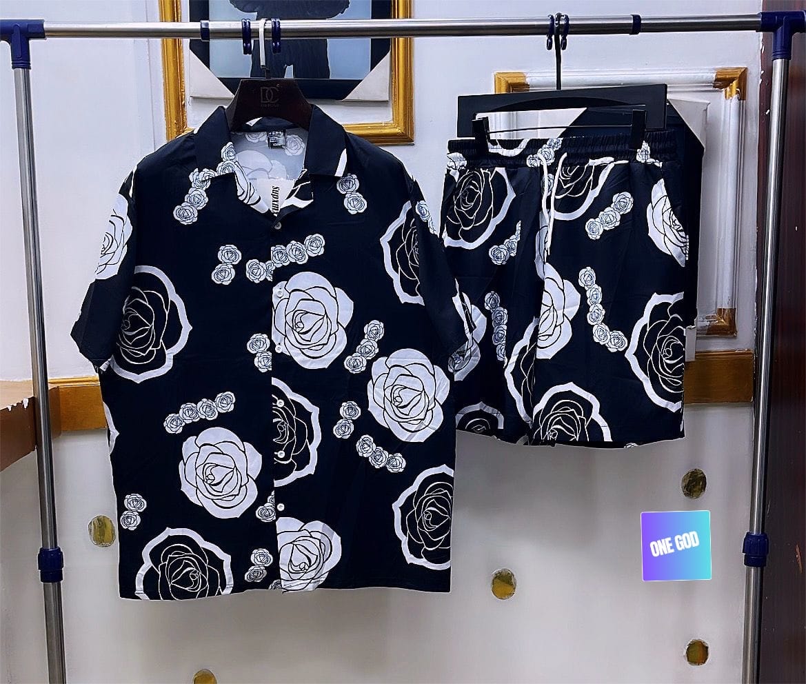 Black two-piece shirt and shorts set with white rose outline prints.