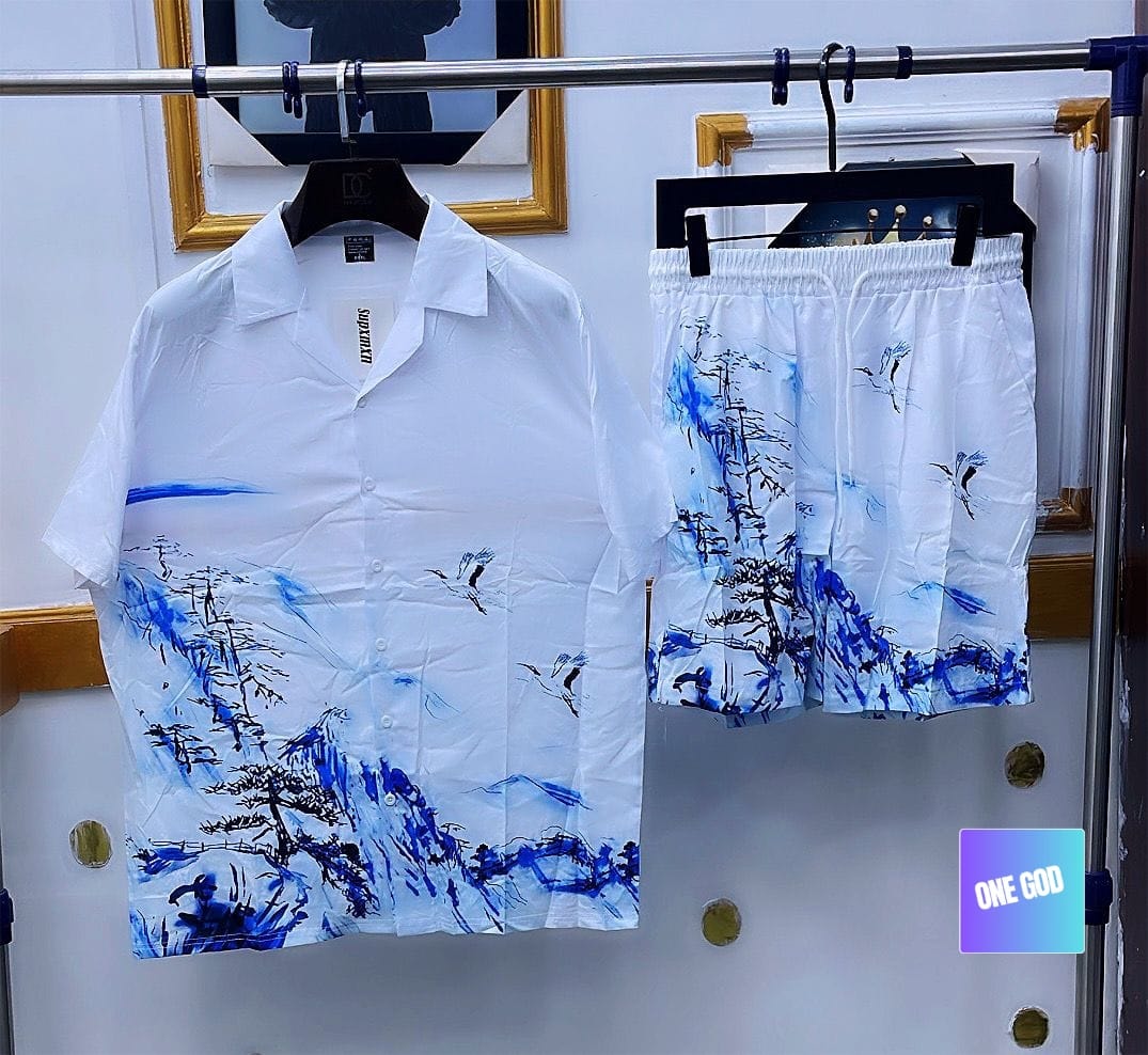 White two-piece shirt and shorts set featuring blue ink wash landscape print with trees and birds.