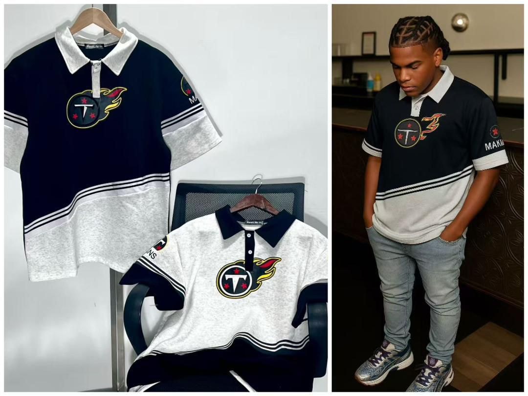 Navy and white colorblock polo shirts with graphic logo on hangers and worn by model with jeans.