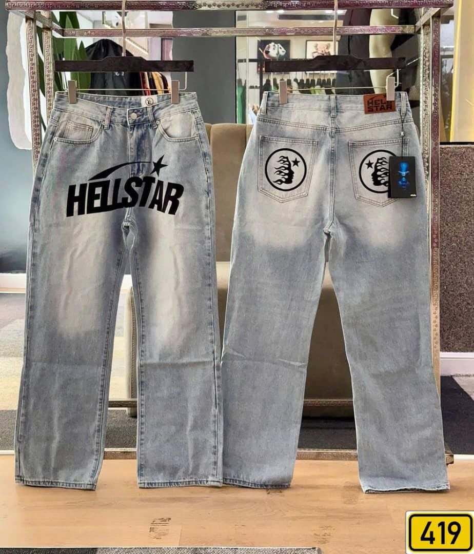 Front and back views of light blue Hellstar baggy jeans with graphic prints and logos.