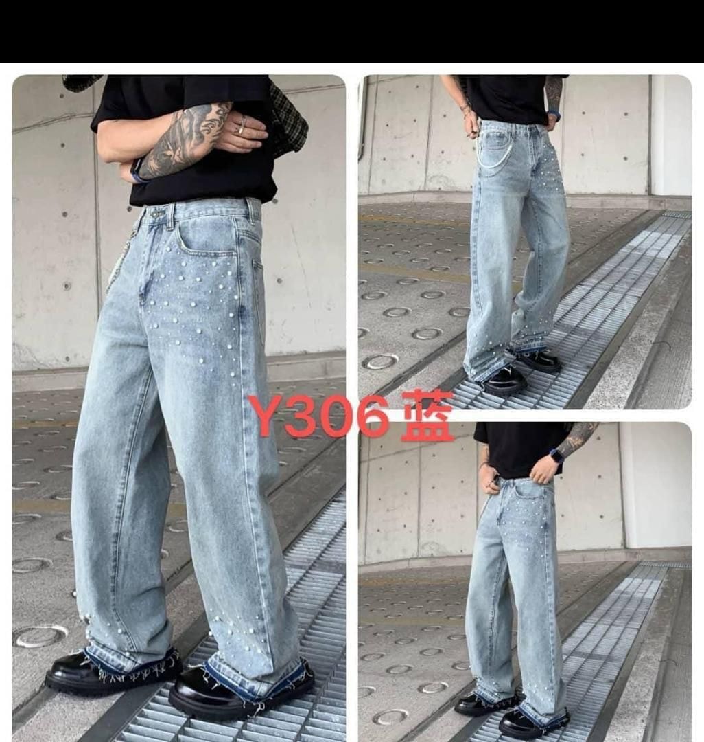 Man wearing light blue baggy jeans with pearl studs along seams and hem, multiple angles shown.