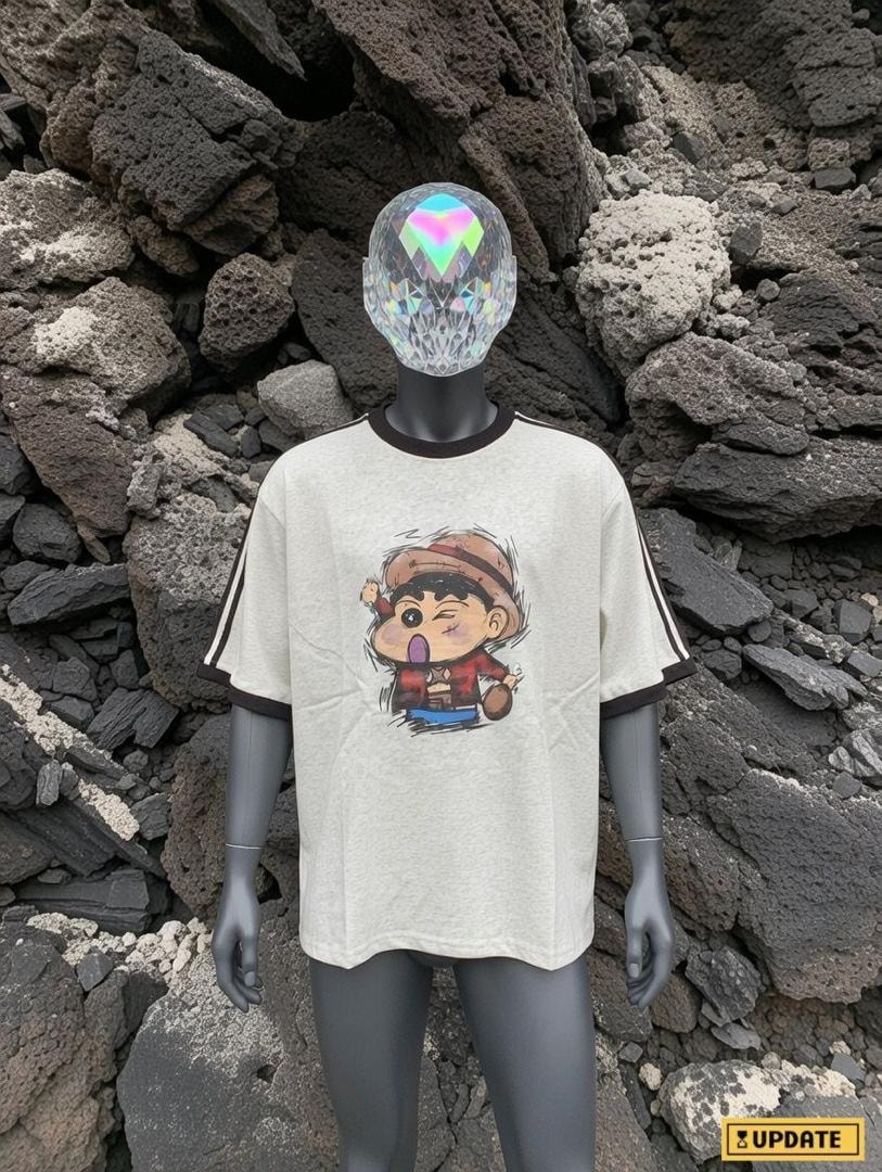 Cream cartoon character graphic t-shirt on mannequin with front view against rocky background.