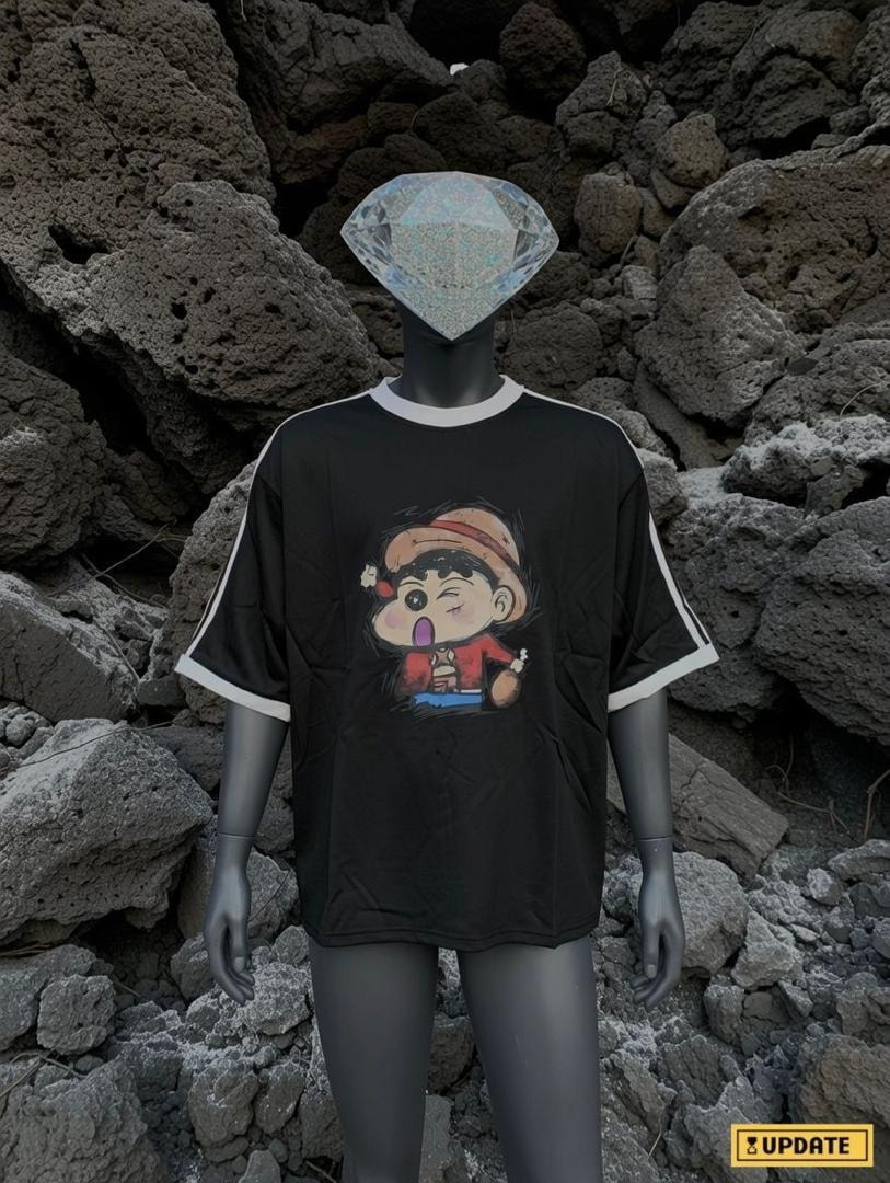 Black cartoon character graphic t-shirt on mannequin with front view against rocky background.