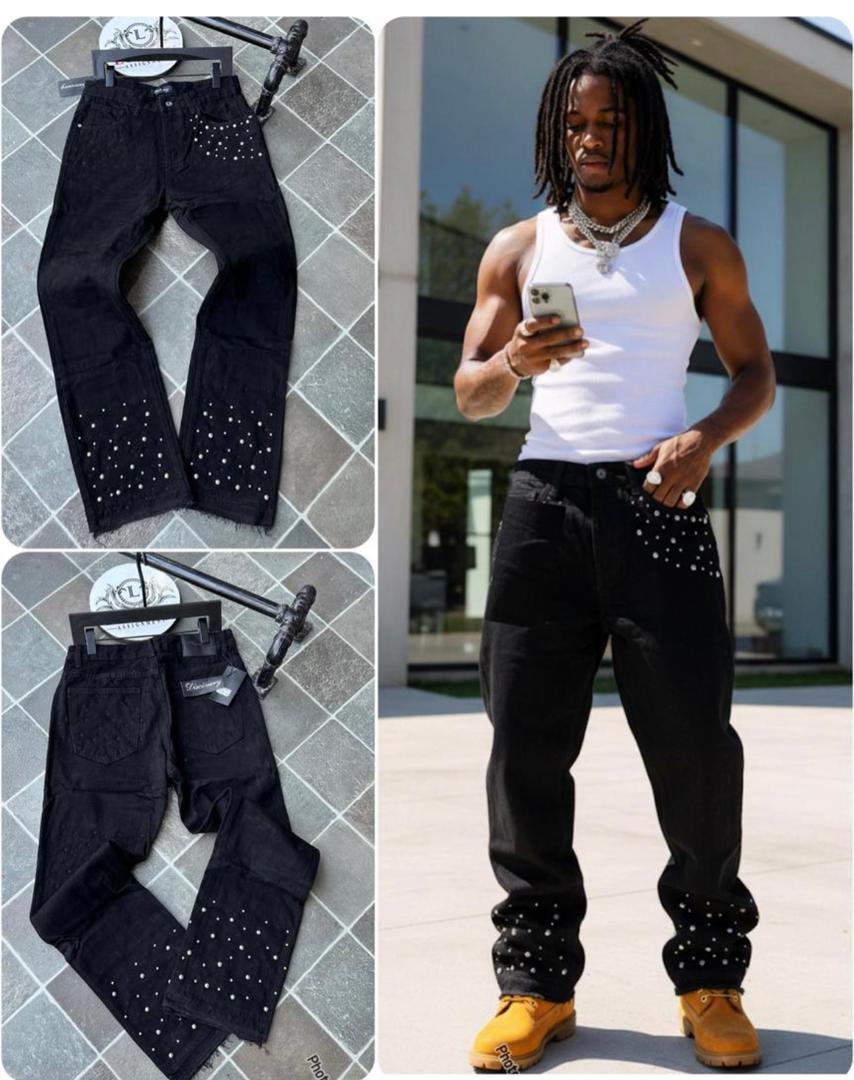 Black baggy jeans with white studs on pockets and legs, displayed in multiple views including on a model.