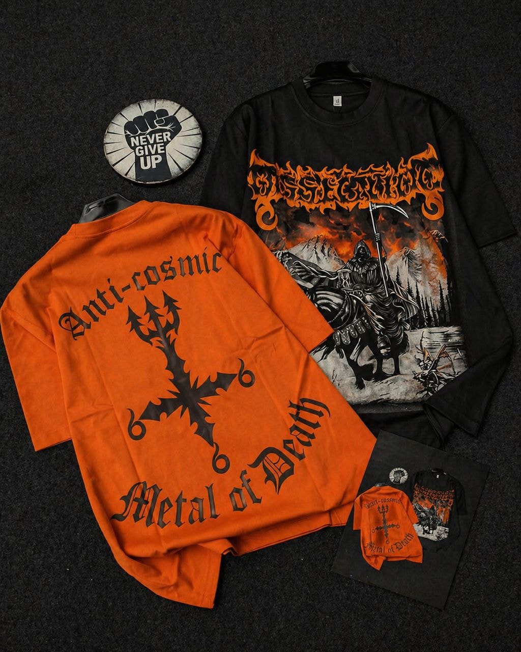 Orange and black fiery reaper and anti-cosmic graphic tees shown front and back.
