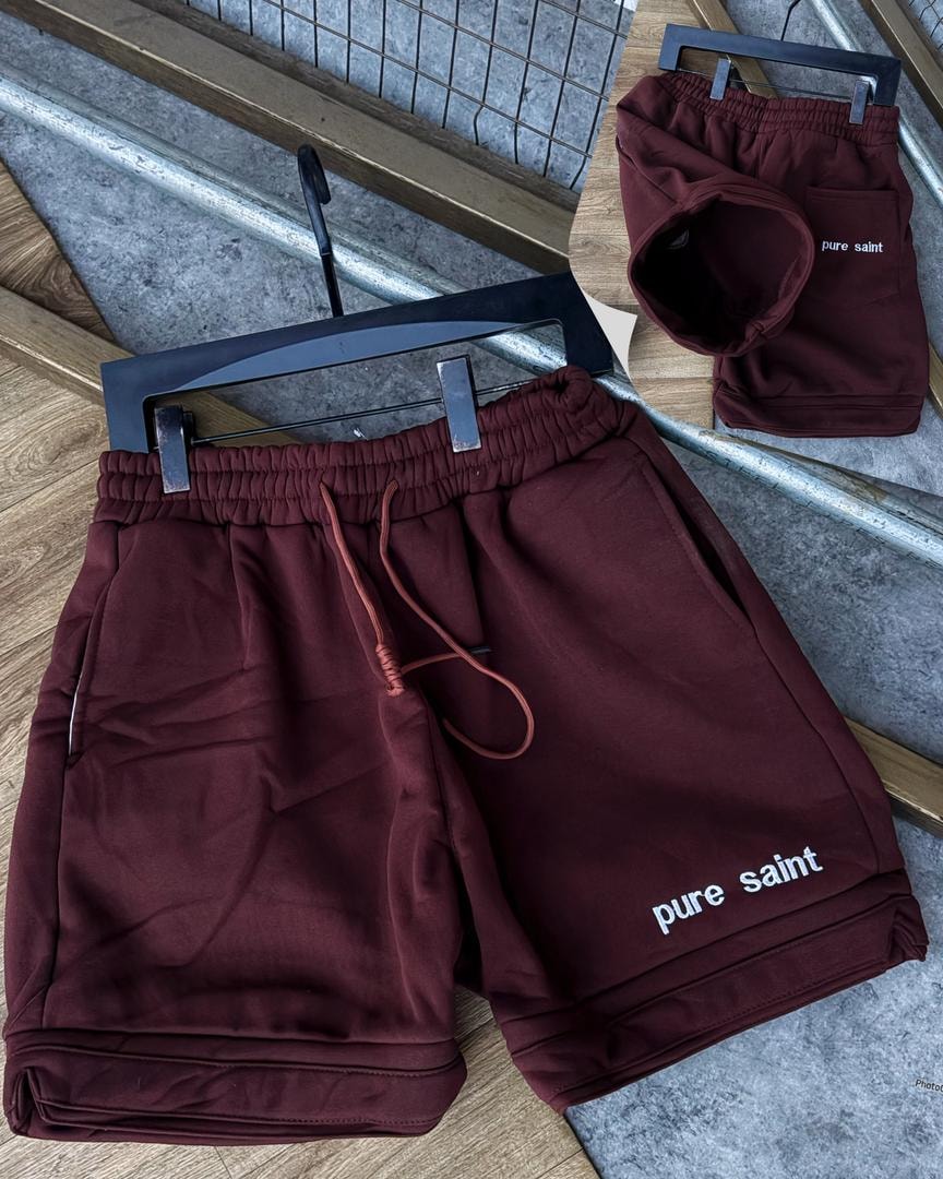Burgundy unisex fleece shorts with pure saint text on leg and back pocket view.