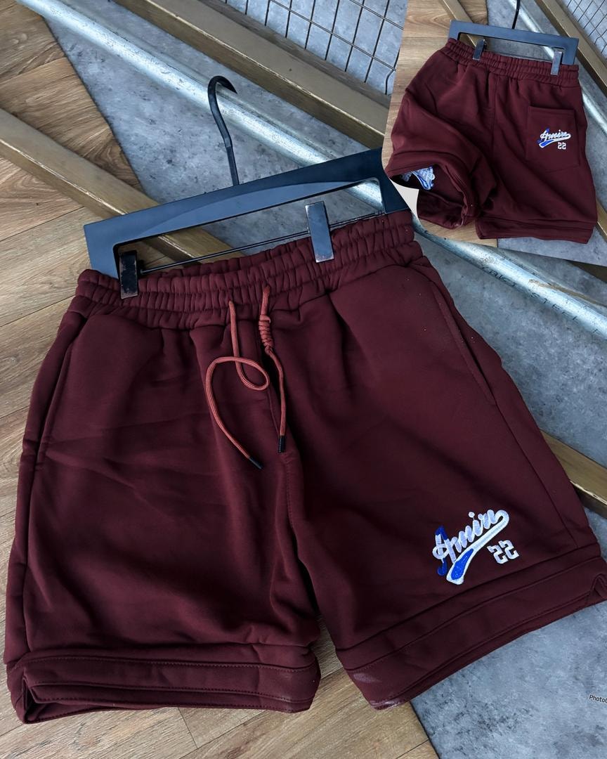 Burgundy unisex fleece shorts with Amour 22 embroidery on leg and back pocket.