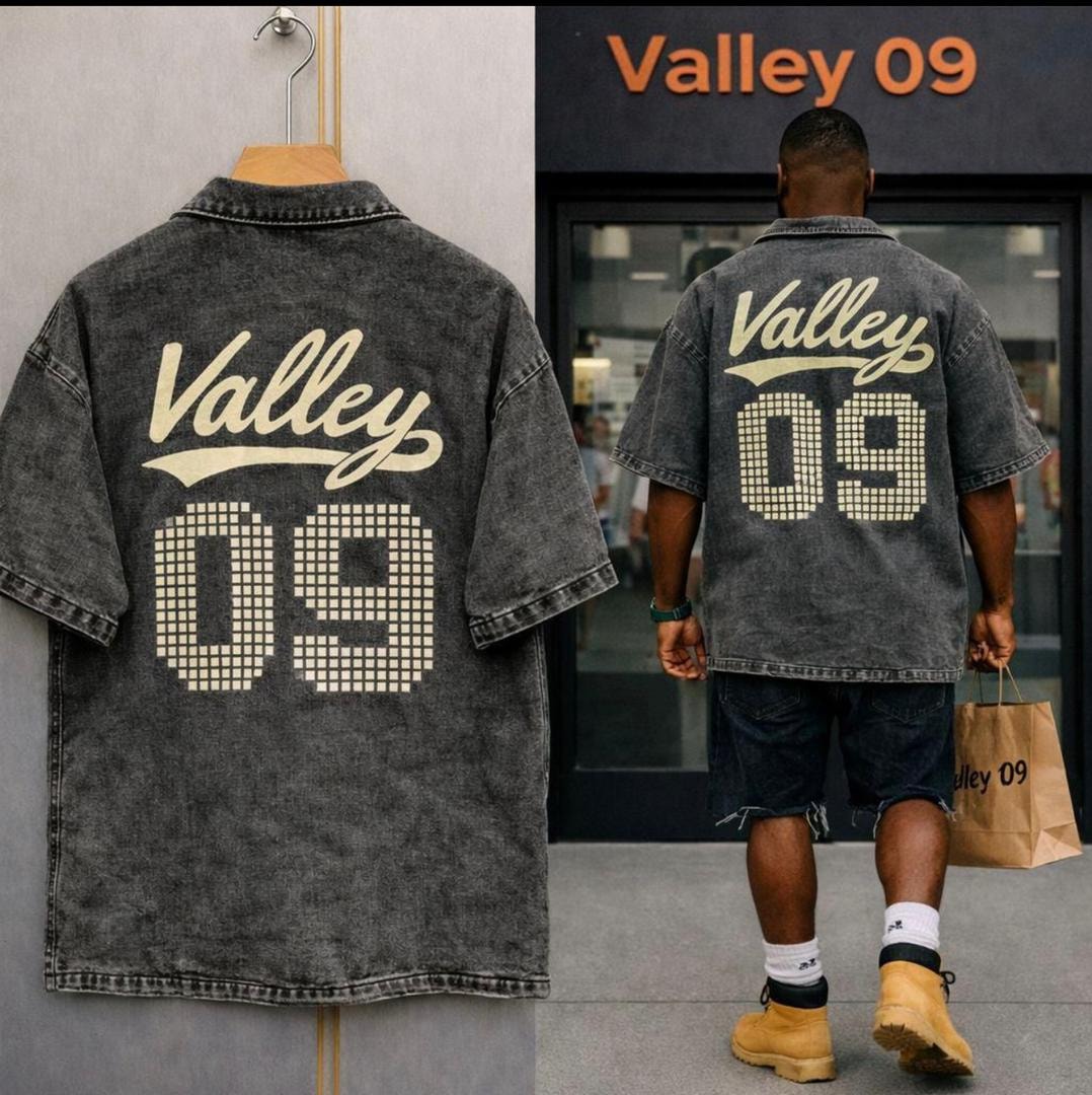 Back view of black Valley 09 denim jacket with large graphic print.