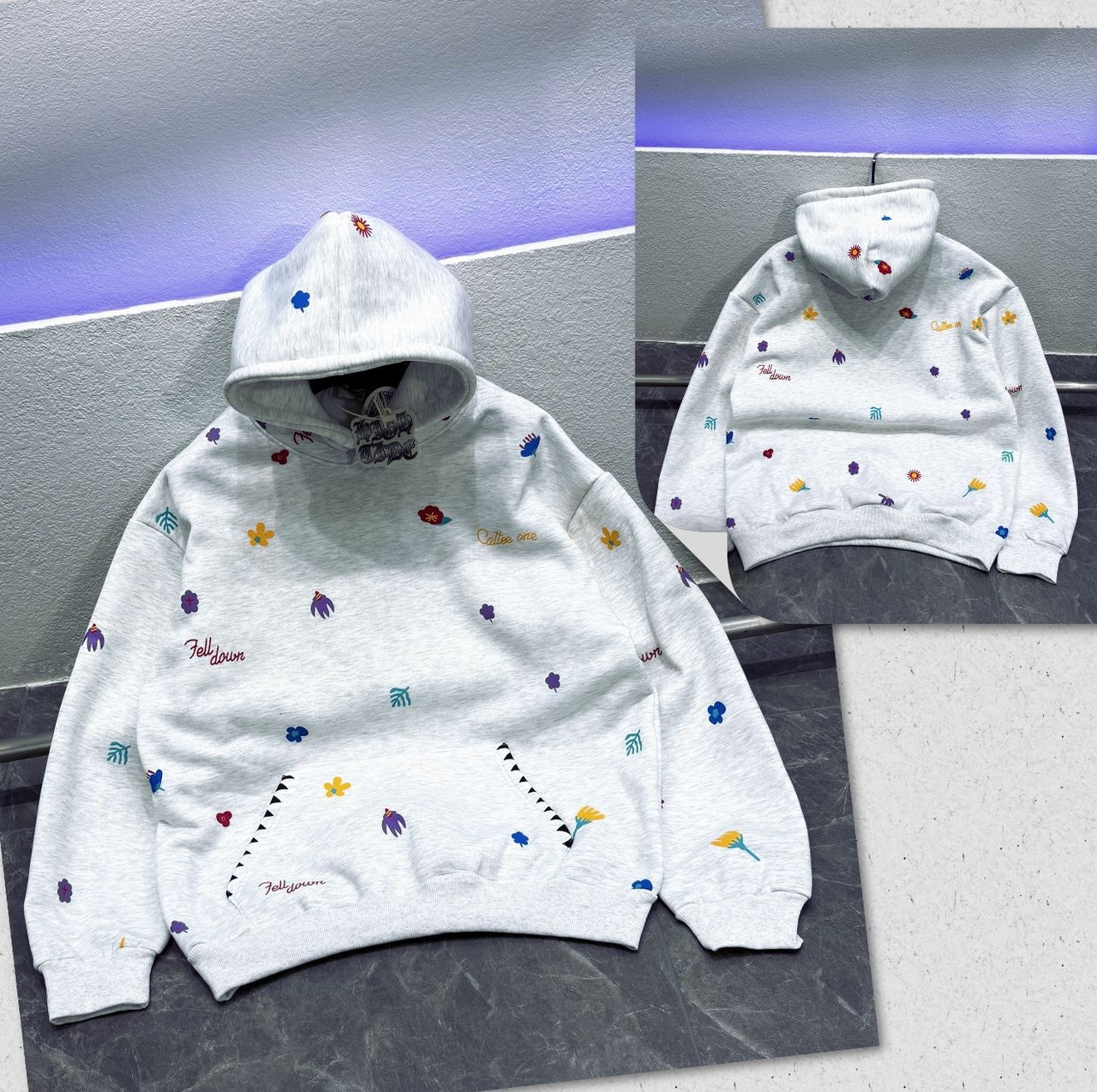 White oversized hoodie with colorful floral and script embroidery, front and back views.