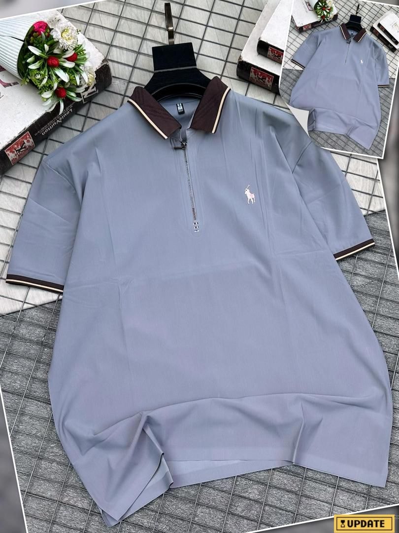 Light blue zip-up polo two-piece set on hanger with matching bottoms and styling elements.