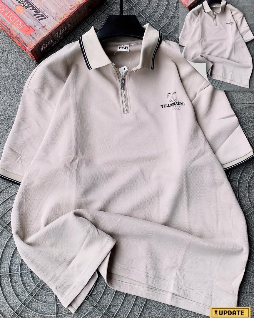 Cream 3ILLIONAIRE quarter-zip polo shirt displayed on hanger with chest embroidery.